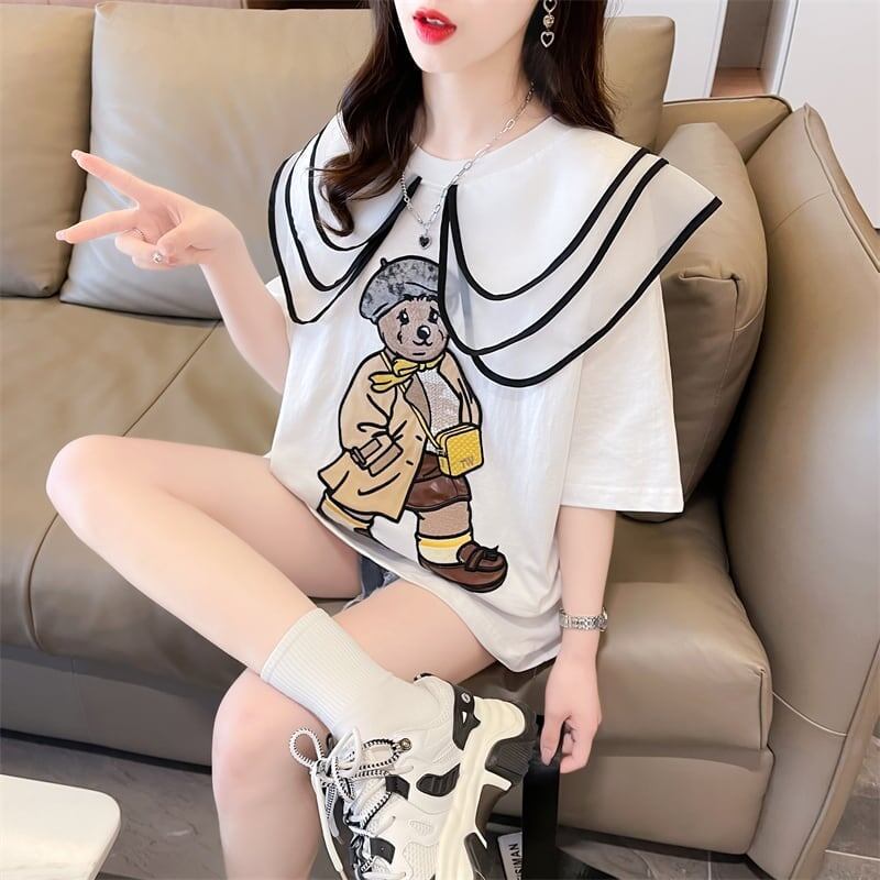 カレッジスタイルのゆったりとしたウエスタンスタイルのネイビーカラー漫画柄Tシャ<F-2897>